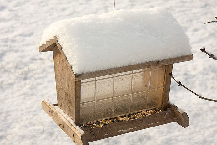 A wooden bird feeder