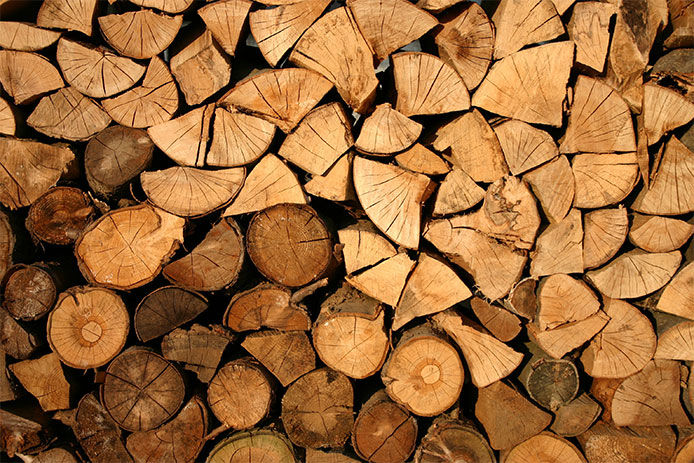 Image full of stacked, split wood