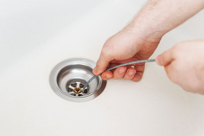 Person snaked an auger down kitchen sink drain