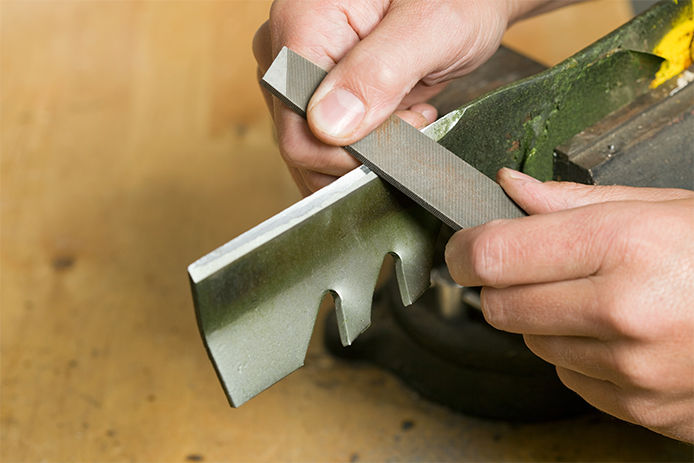 Sharpening the blade of a lawn mower