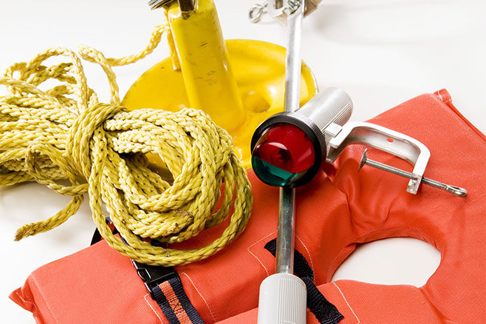 A close up image of a Lifejacket, anchor and beacon