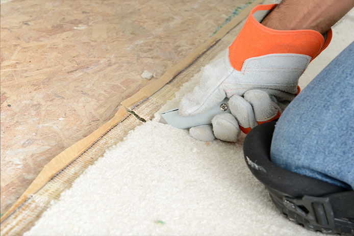 Person pulling carpet out