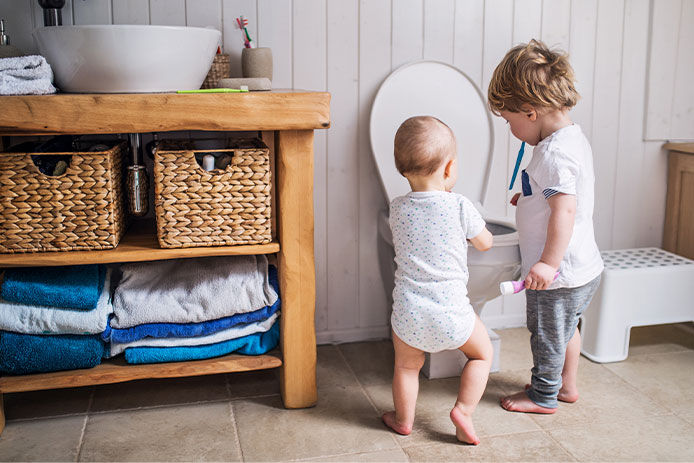 Children playing in a bathroom