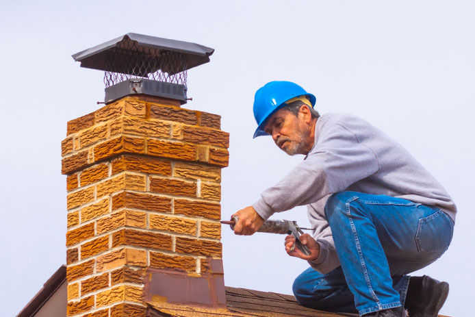 Man working on chimney