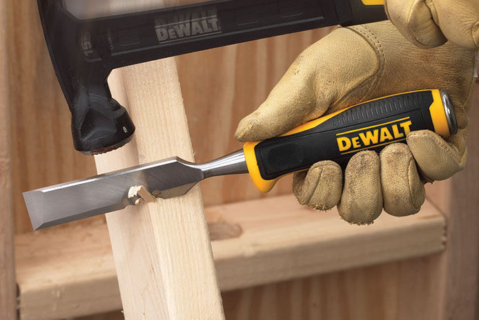 DEWALT handheld wood chisel and hammer being used on a piece of wood