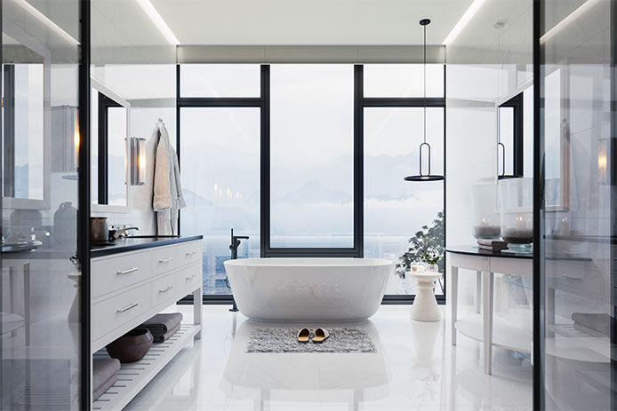 A very clean bathroom with large windows