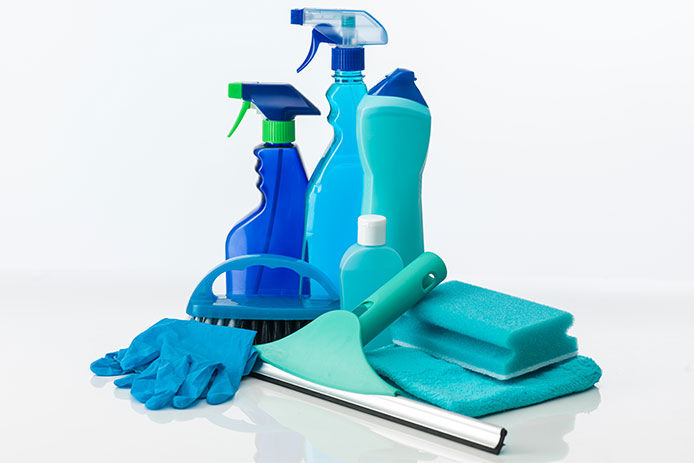 Generic cleaning supplies on a white background