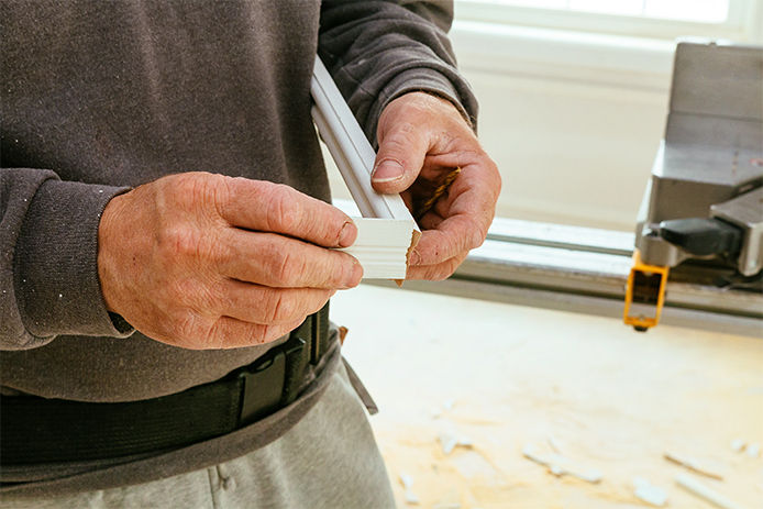 Construction worker, Trimming parquet on using circular miter saw cutting