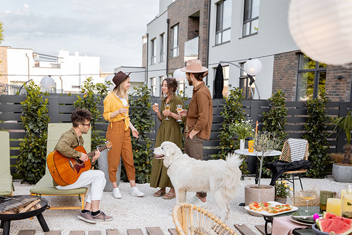 A group of people and a dog enjoying an outdoor space