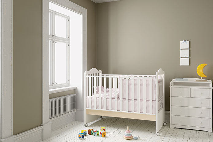 Very minimal baby nursery with olive walls