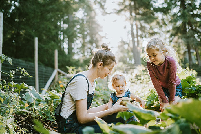 A family looking at plants