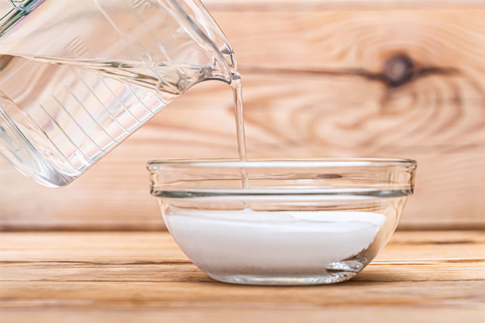 Pouring water into powder.