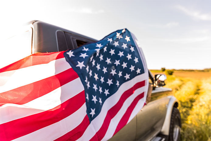 American flag and car