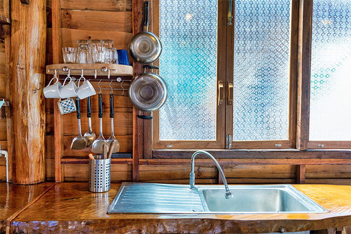 Window frost treatment to windows by kitchen sink