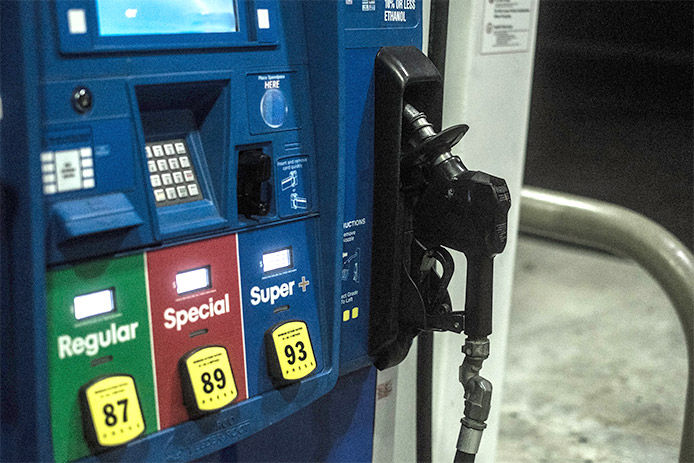 An image of a blue gas pump that has regular, special, and super + types of gas