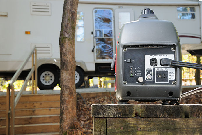 A generator plugged into an RV