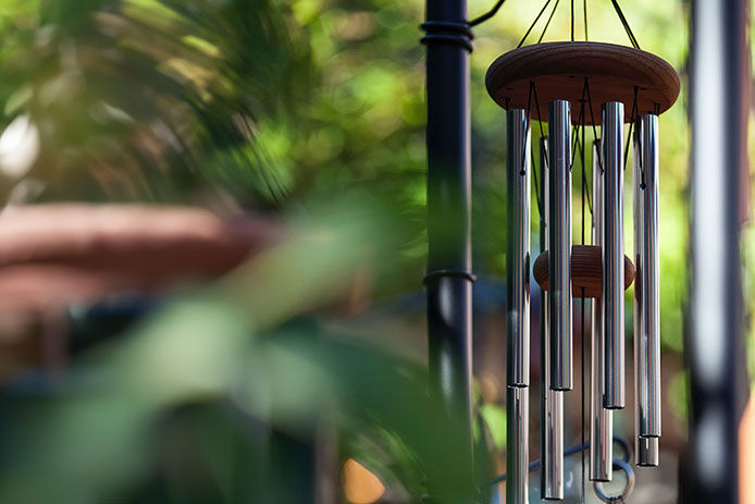 Wind chimes handing on a porch