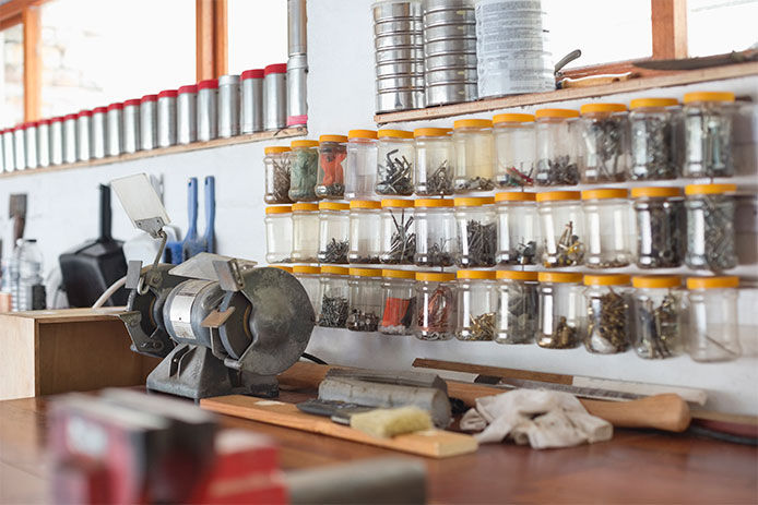 Glass jars being used to organize small hardware