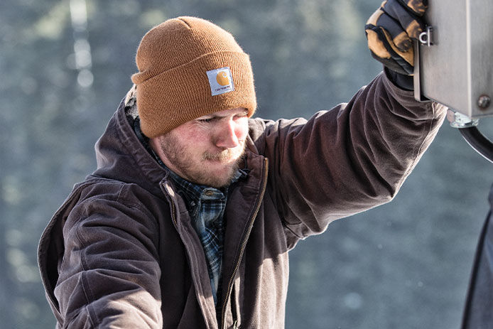 Man wearing hat and gloves