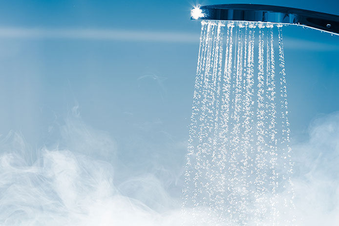 Hot water steaming from the shower head