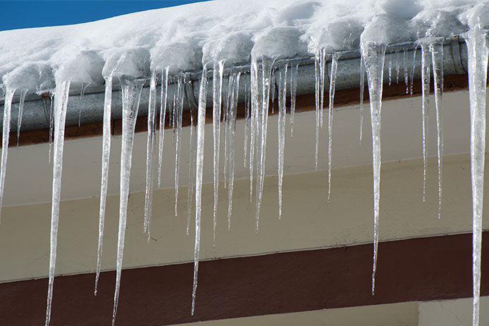 Icicles hanging off the roof gutter