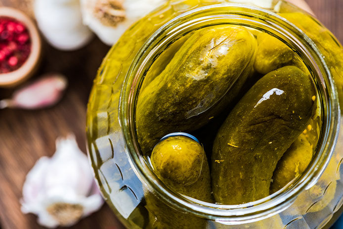 Pickled gherkins in jar, fermented food 