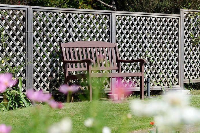 Lattice being used behind a bench for privacy