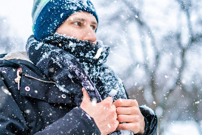 Man outside wearing layers of clothes