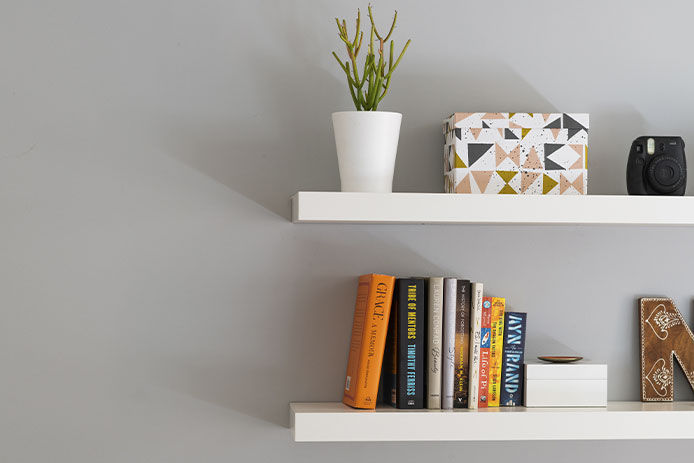 Floating shelves with books on them