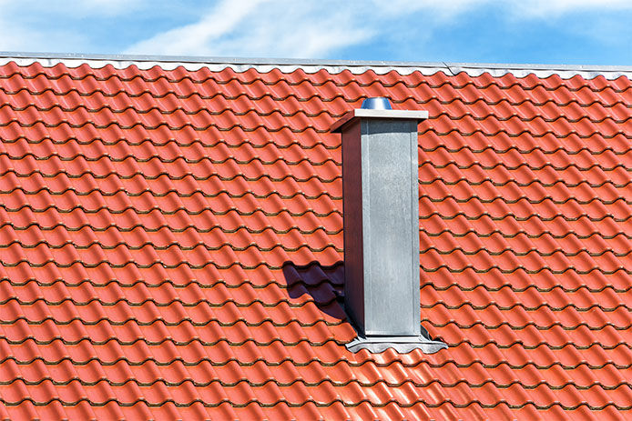 Metal chimney on a roof