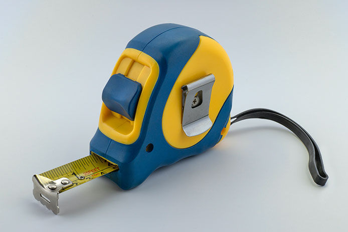 blue and yellow tape measure with belt clip 