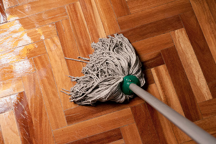 Mop with wet wooden floors