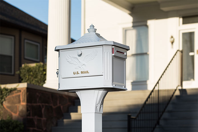 White mailbox in front of a house