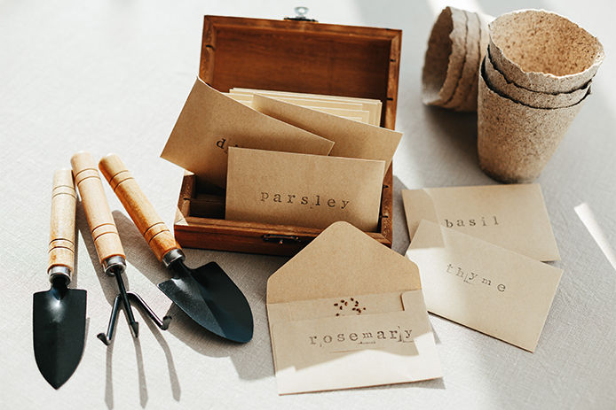 Small brown envelopes labeled with seeds