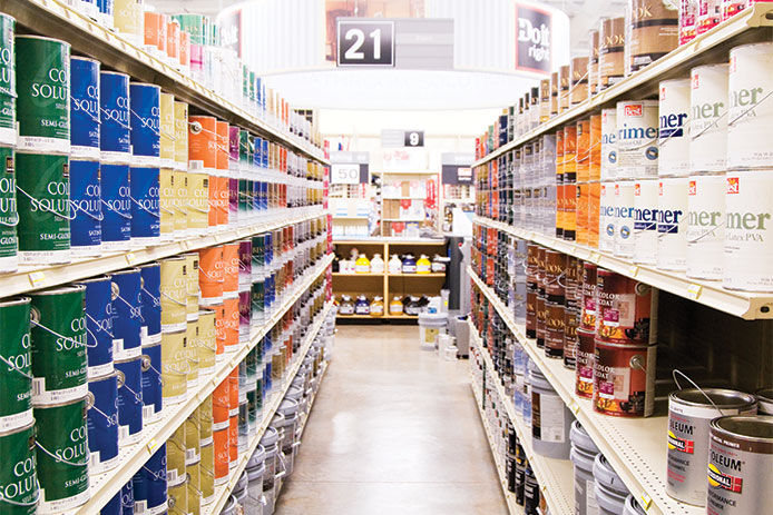 Looking down a store isle of paints and primers