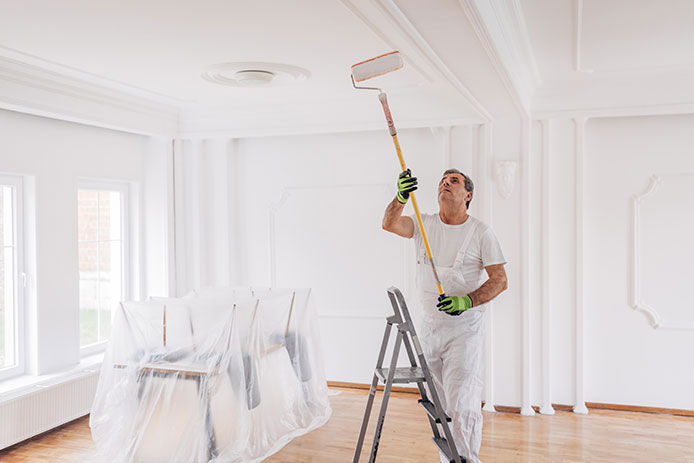 Man paiting a ceiling