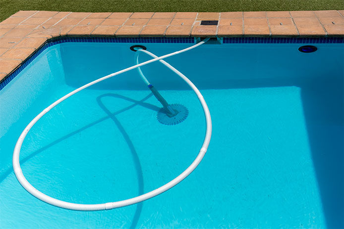 Pool vacuum cleaner has a long hose and a cleaning head that can be attached to the end. The hose is attached to the skimmer basket or a dedicated vacuum line to suck up debris from the pool floor and walls. The vacuum cleaner is specifically designed for cleaning swimming pools and can help remove dirt, leaves, bugs, and other debris from the water, keeping the pool clean and clear.