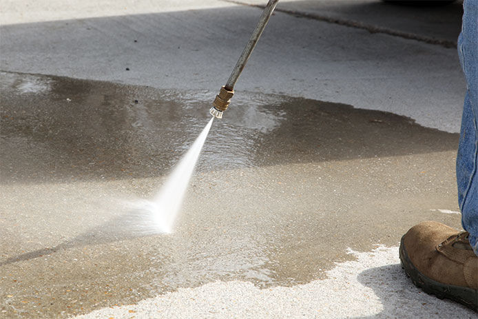 Pressuer washing a driveway