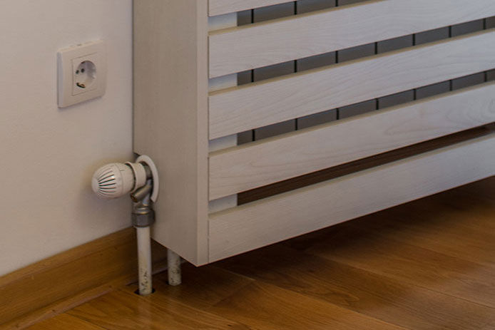 White radiator cover made from pallets