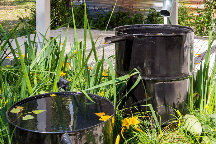 System for collecting rainwater from two barrels with overflow