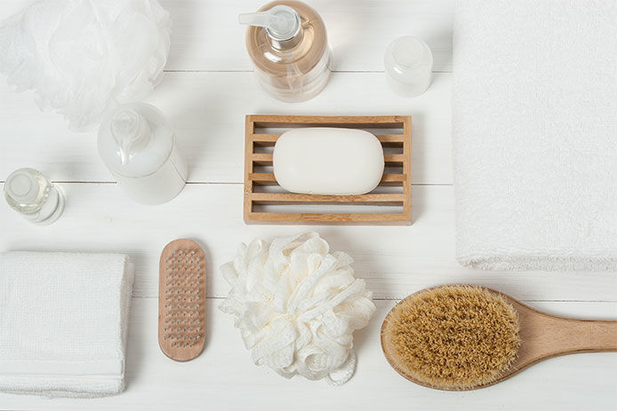 Loofah, foot scrubber, bubble bath products, and a nice-smelling body wash