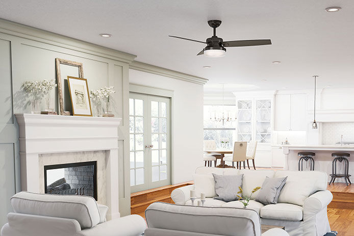 A modern white living room wiht a black ceiling fan 