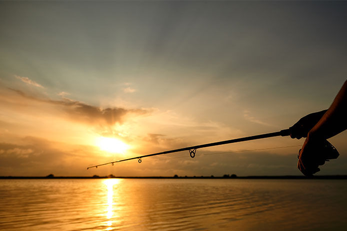 River fishing at sunset