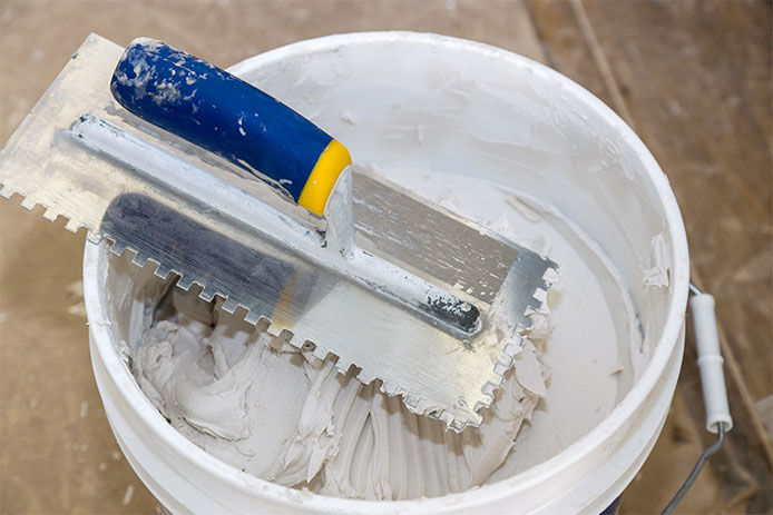 Grout in a white bucket