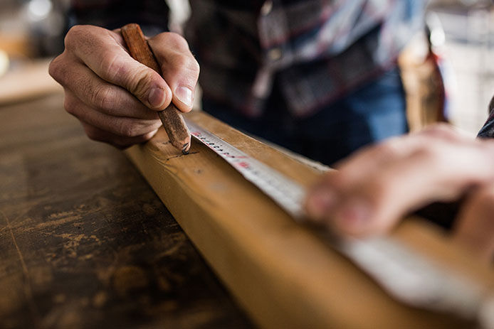 Measuring wood with a tape measure