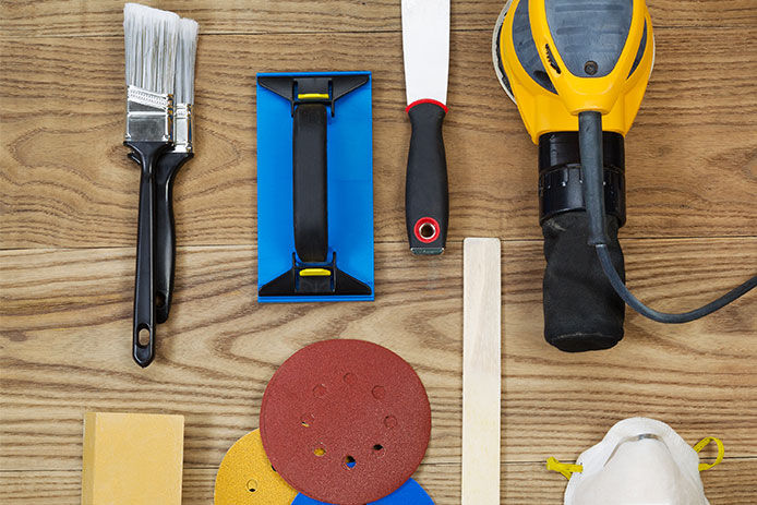 Some tools you may need from an overhead view on wooden flooring