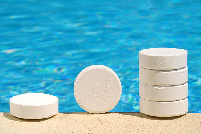Chlorine tablets stacked by a pool
