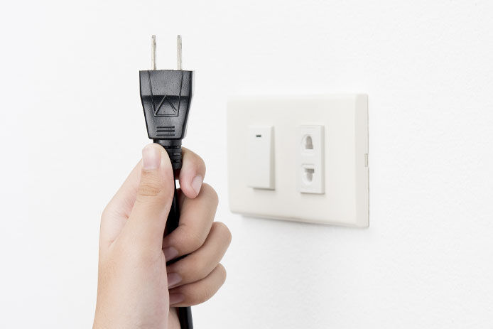 Unplugging a cord from an outlet