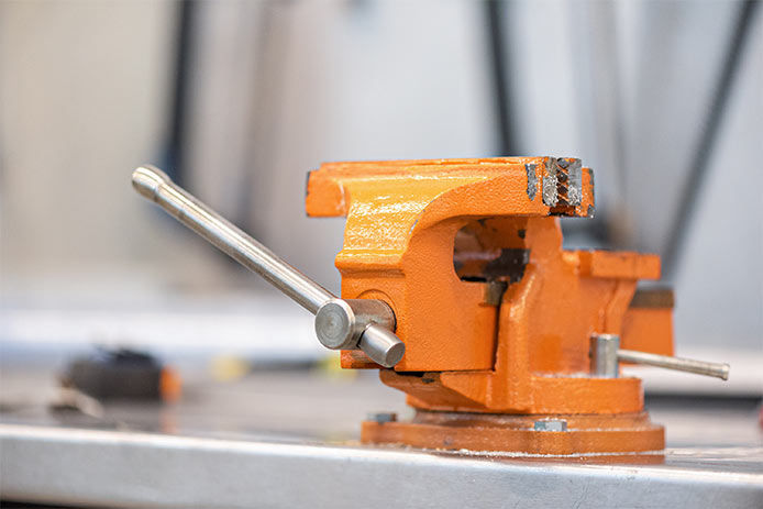 An orange vise clamp