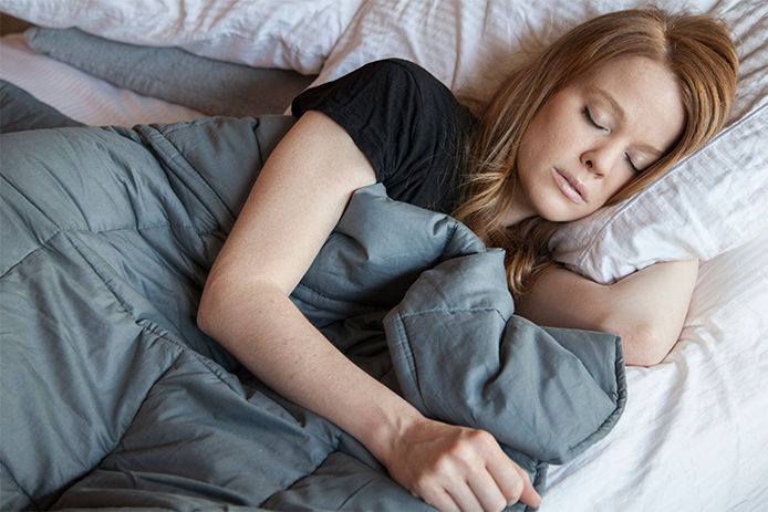 Woman in bed peacefully sleeping